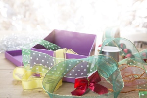 preparing for christmas with gift box and ribbons